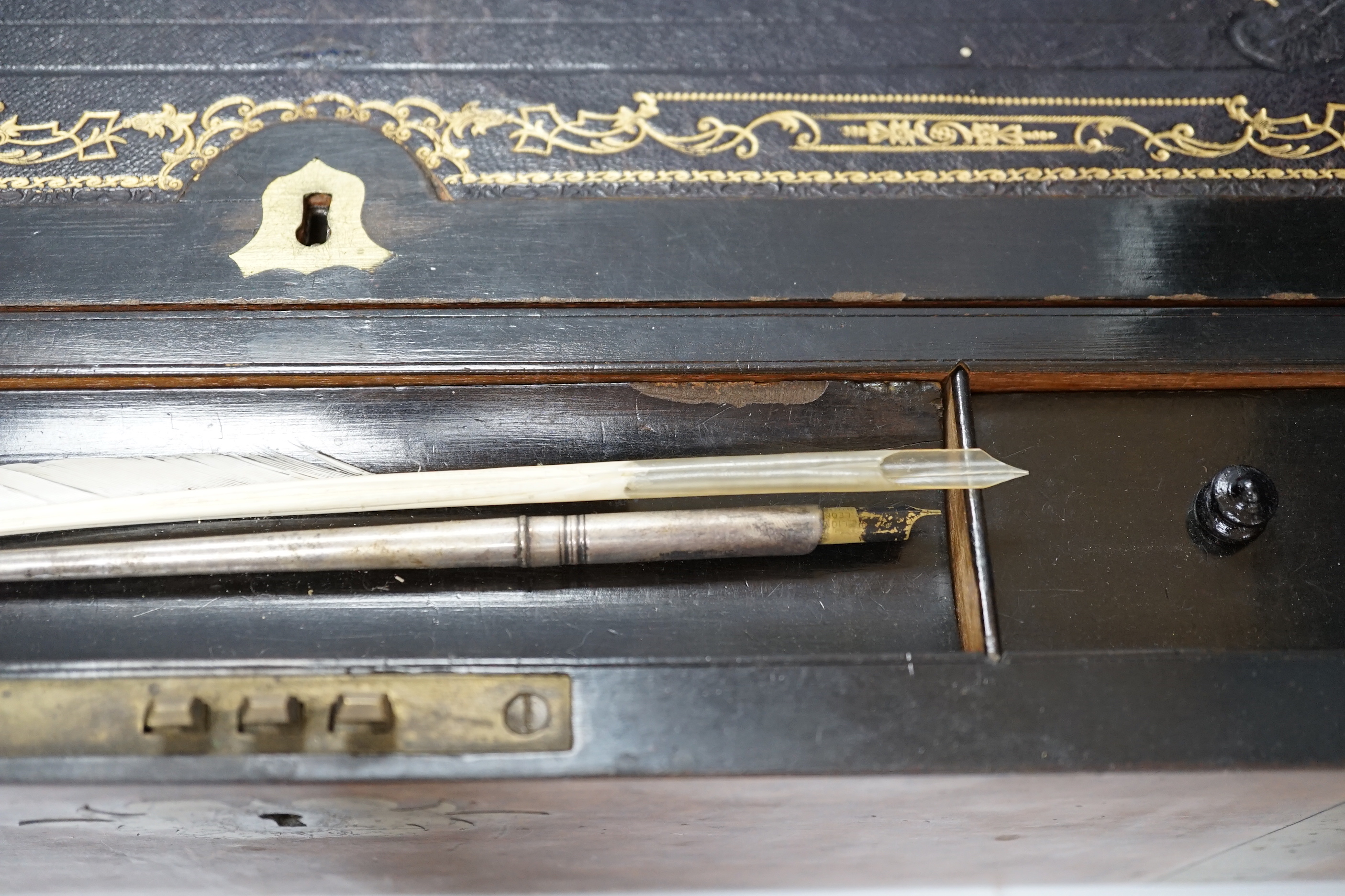 A Victorian walnut brass bound writing slope, 50cm wide x 25cm deep x 18cm high